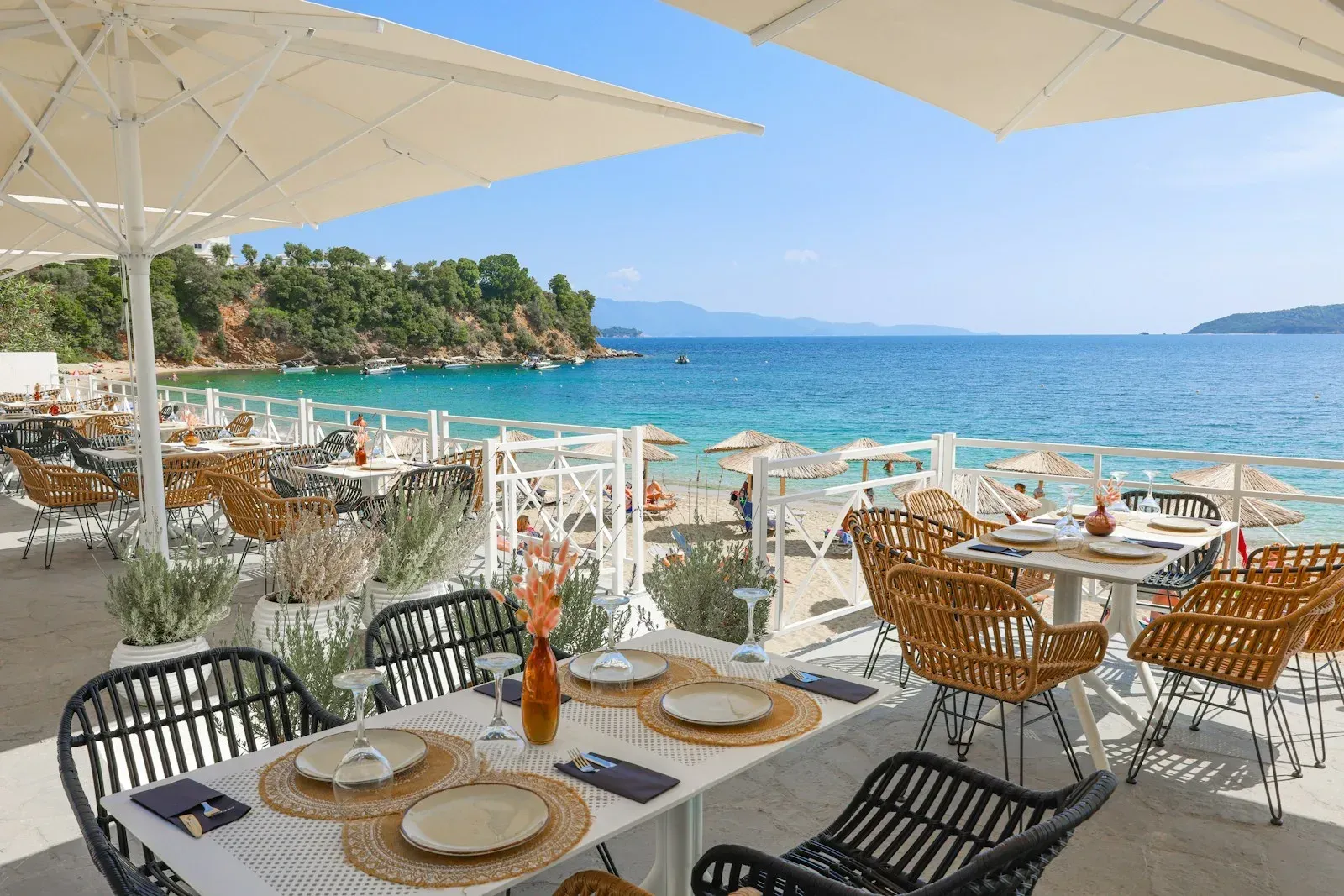 Outdoor coastal dining terrace overlooking the sea