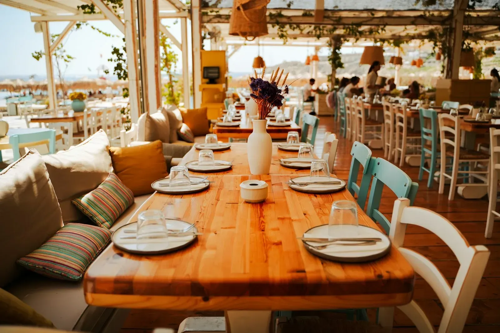 Restaurant tables arranged beside an ocean view